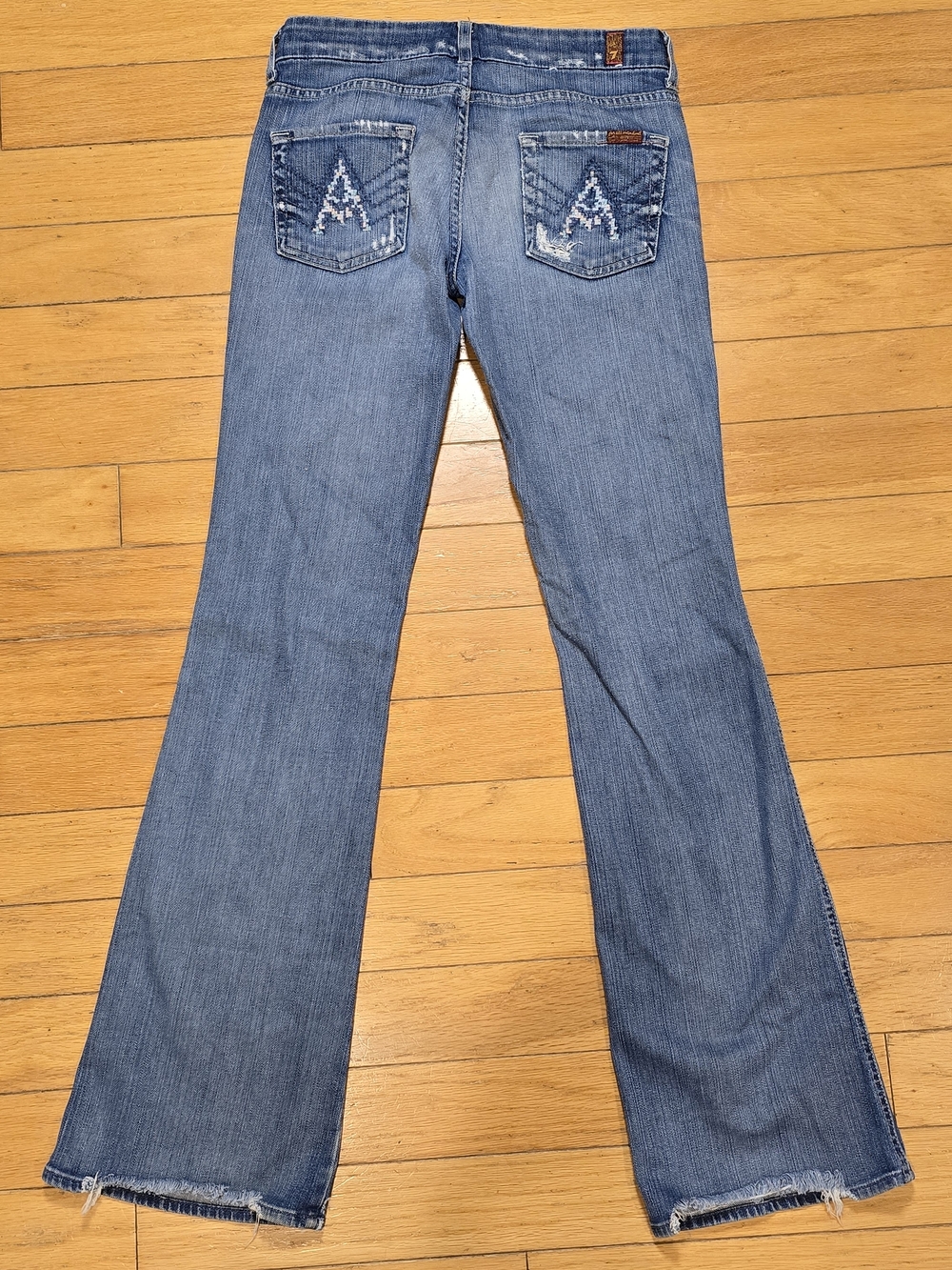 7 For All Mankind Light Blue Flare Jeans with Embroidered Back Pockets